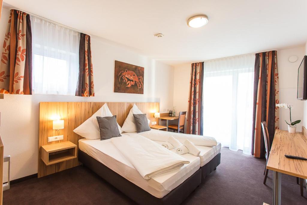 Postel nebo postele na pokoji v ubytování Schäfer Boardinghouse