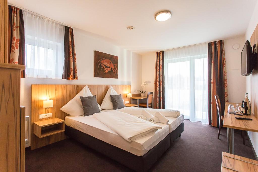 Postel nebo postele na pokoji v ubytování Schäfer Boardinghouse