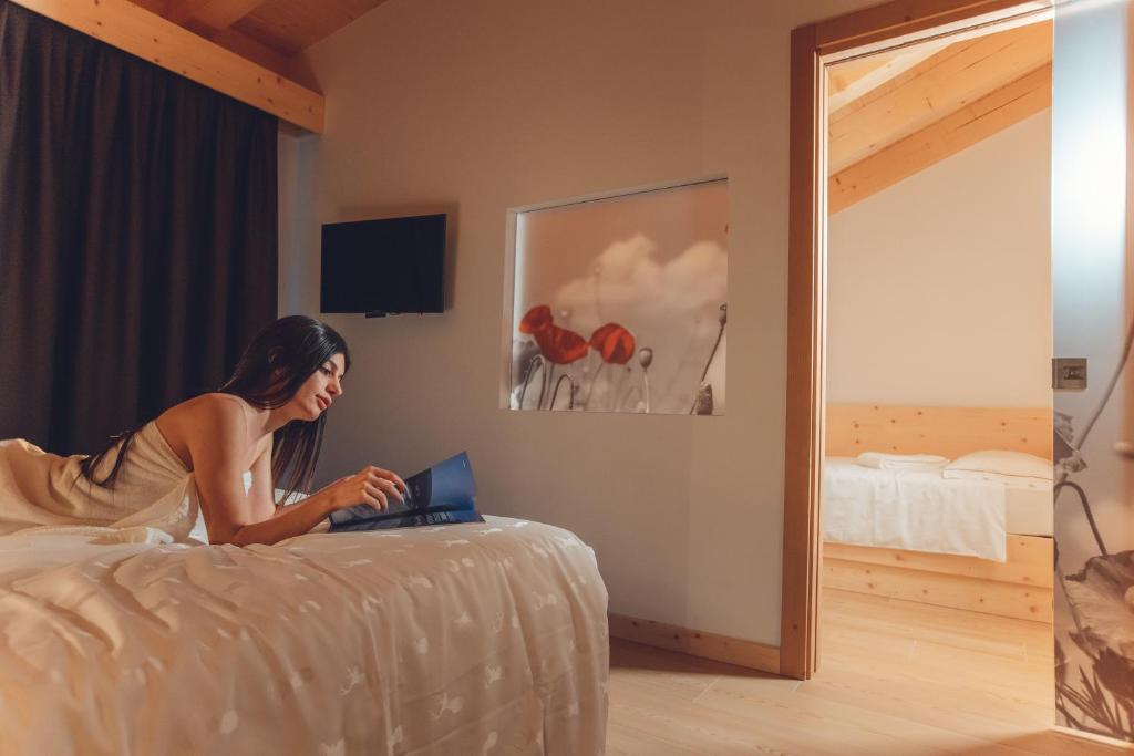 Postel nebo postele na pokoji v ubytování Hotel La Perla