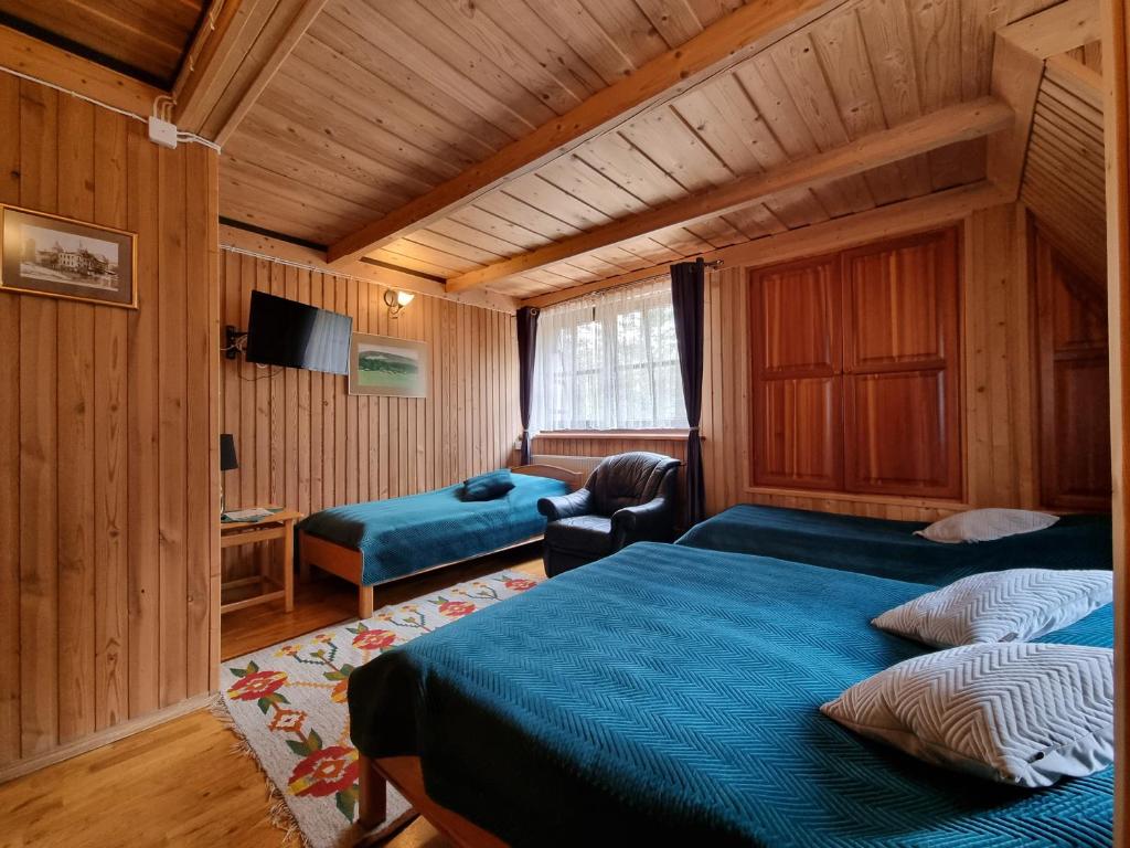 Postel nebo postele na pokoji v ubytování Zajazd Józef
