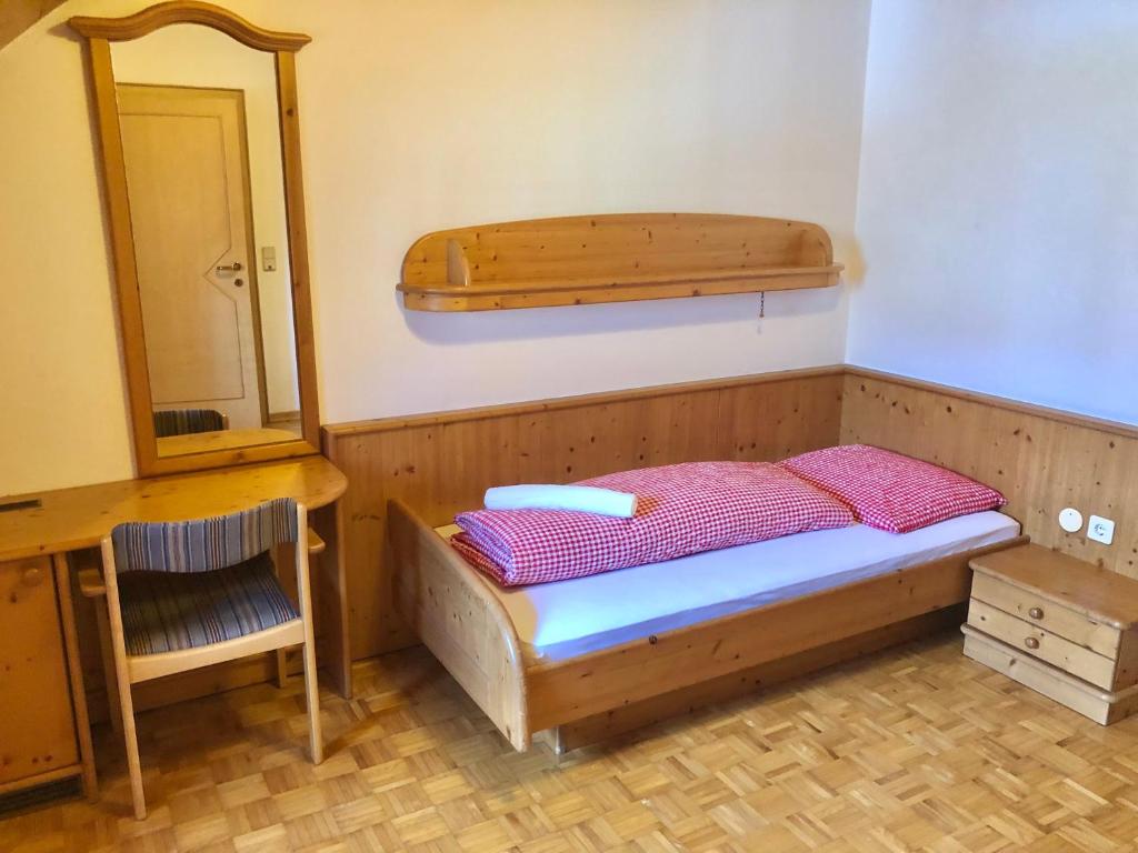 Postel nebo postele na pokoji v ubytování Hotel Ledererwirt