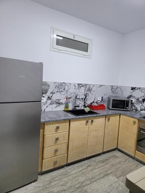 Kuchyň nebo kuchyňský kout v ubytování Ras Jebel appartements