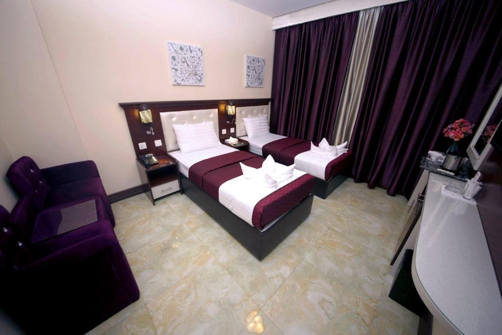 Postel nebo postele na pokoji v ubytování Mariana Hotel