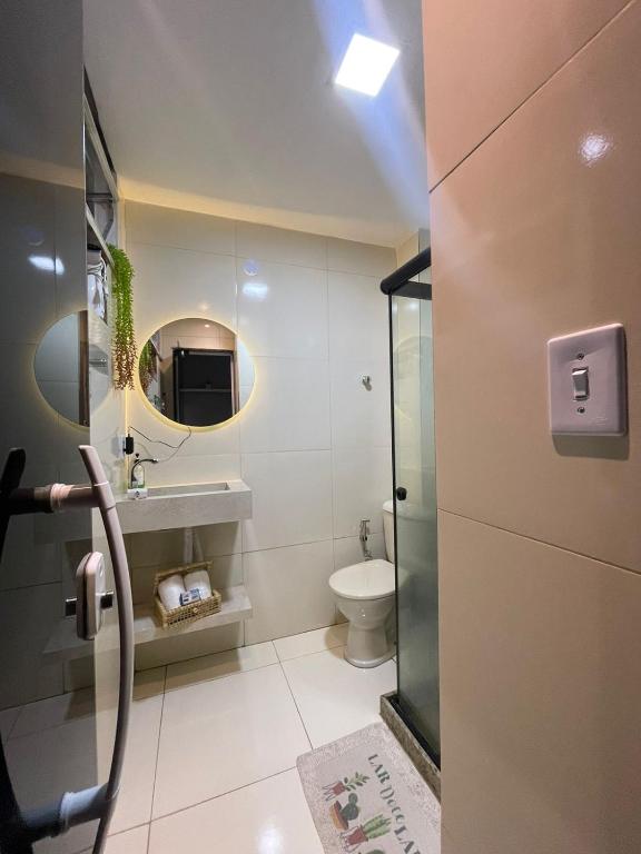 Hotel Loft 601, a bathroom with a toilet and a sink and a mirror at Loft 601 in Rio de Janeiro