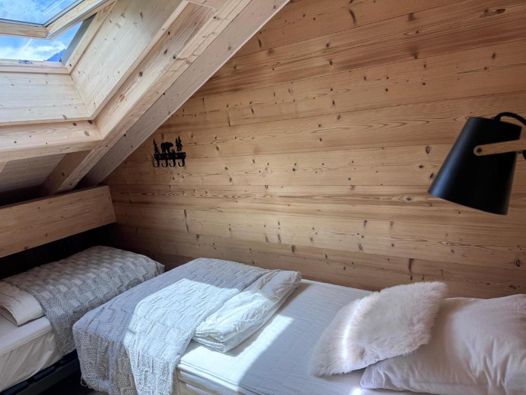 Postel nebo postele na pokoji v ubytování La Rose des neiges à Châtel
