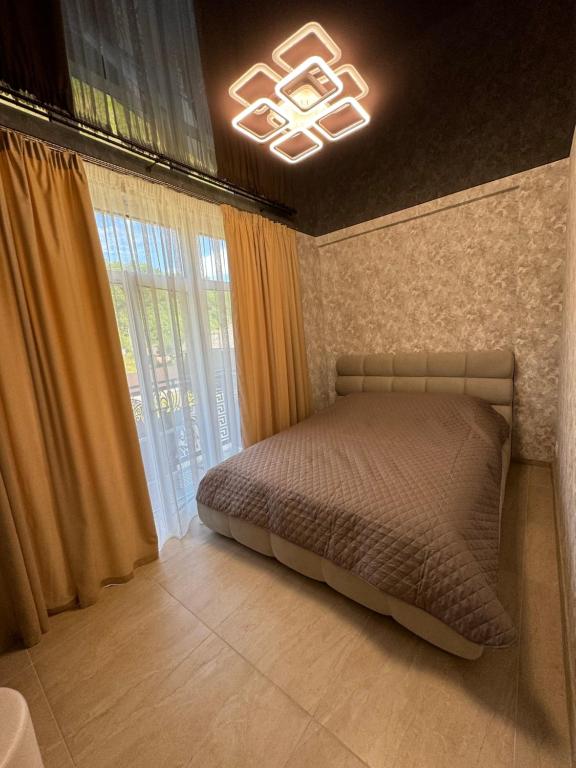 Postel nebo postele na pokoji v ubytování Guest Apart Polyana