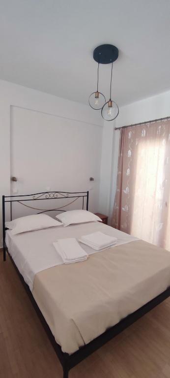 Postel nebo postele na pokoji v ubytování Φάρος Αρκίτσας