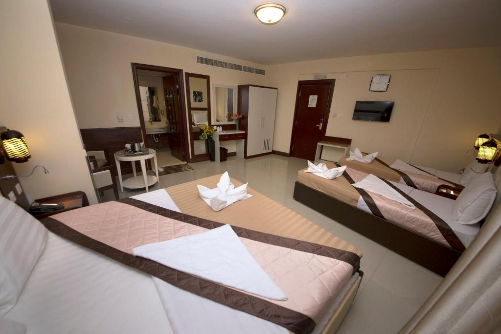 Postel nebo postele na pokoji v ubytování Mariana Hotel