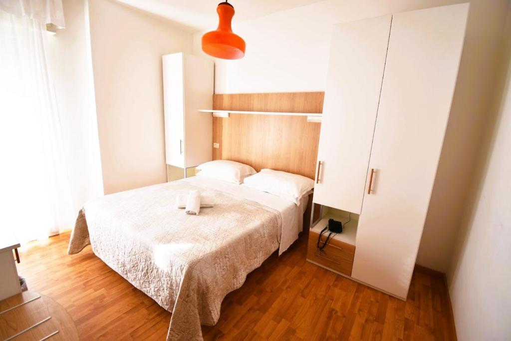 Postel nebo postele na pokoji v ubytování Hotel Galles