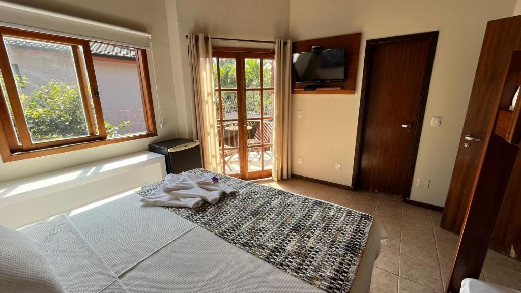 Cama ou camas em um quarto em Pousada Moryba