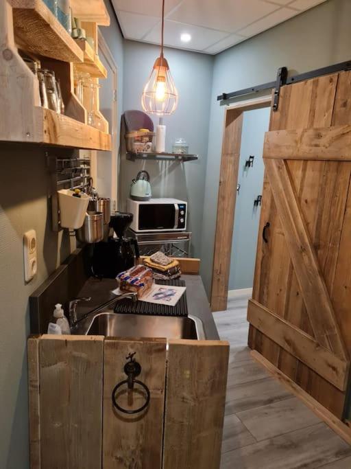 Kuchyň nebo kuchyňský kout v ubytování Appartement De Oliekan Medium