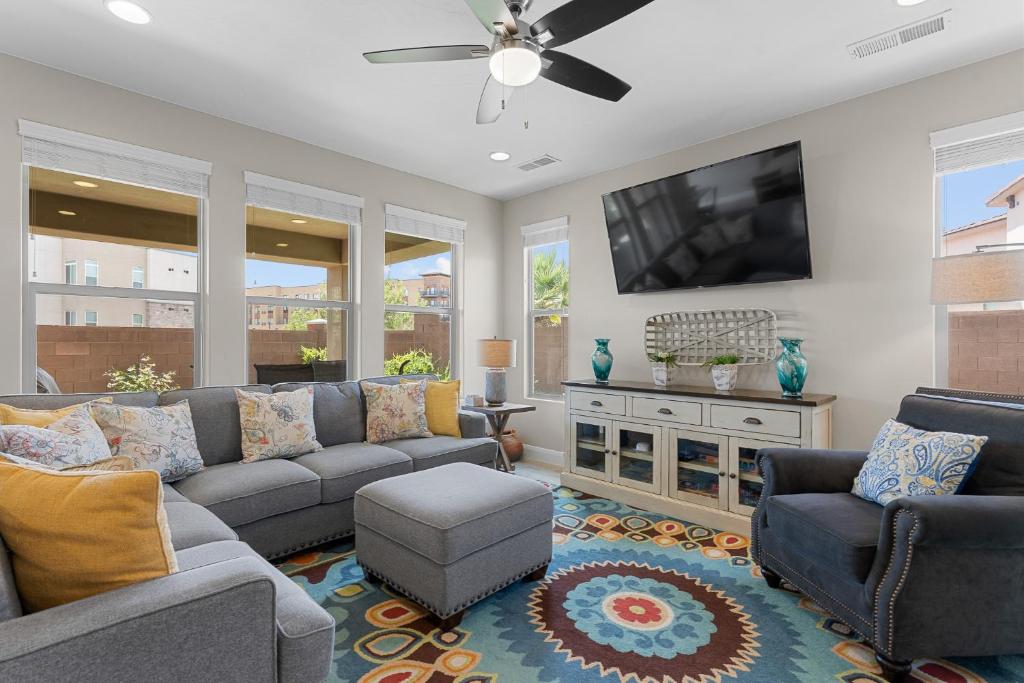 a living room with a couch and a flat screen tv at House It Going home in Washington