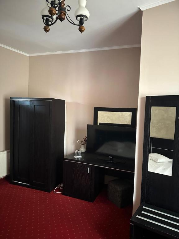 TV a/nebo společenská místnost v ubytování Hotel Rubin***
