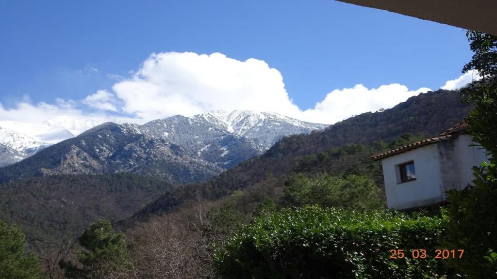 a view of a mountain range with snow covered mountains at F1 Massif du Canigou in Vernet-les-Bains