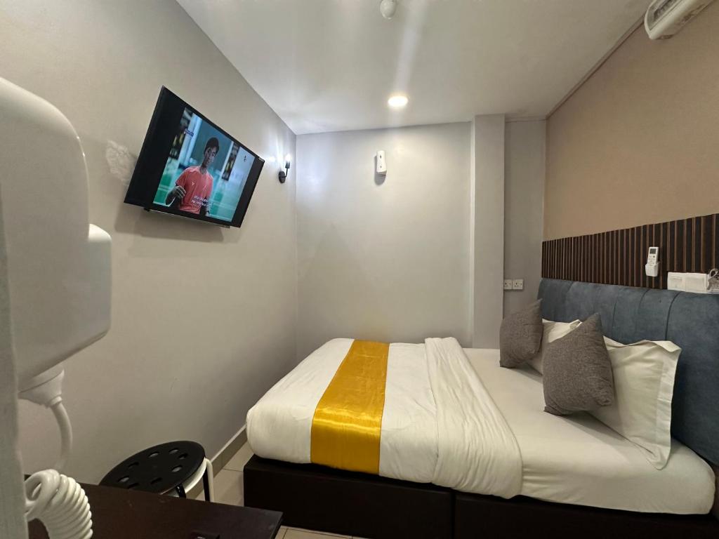 Postel nebo postele na pokoji v ubytování SS Grey Hotel 2