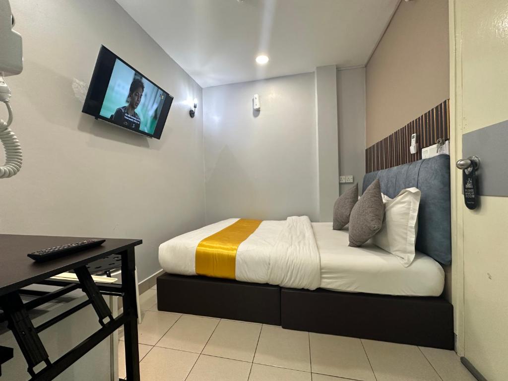 Postel nebo postele na pokoji v ubytování SS Grey Hotel 2