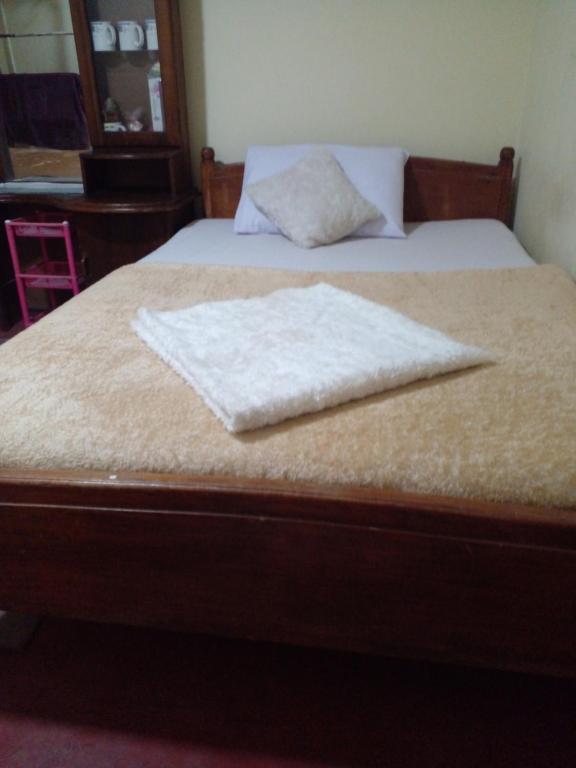 Postel nebo postele na pokoji v ubytování Haranya Homestay