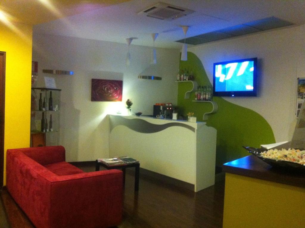 TV a/nebo společenská místnost v ubytování Hotel Milano