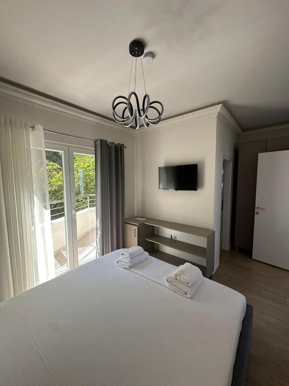 Postel nebo postele na pokoji v ubytování Hotel DEMOLI