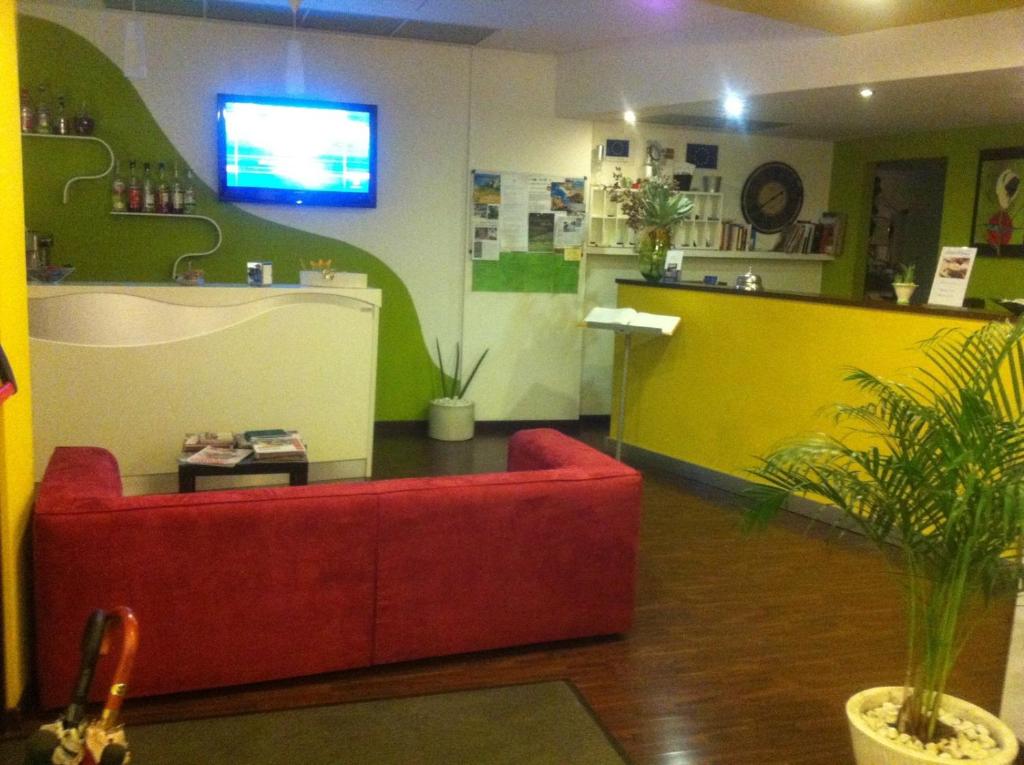 TV a/nebo společenská místnost v ubytování Hotel Milano