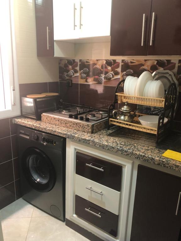 Kuchyň nebo kuchyňský kout v ubytování Appartement confortable neuf