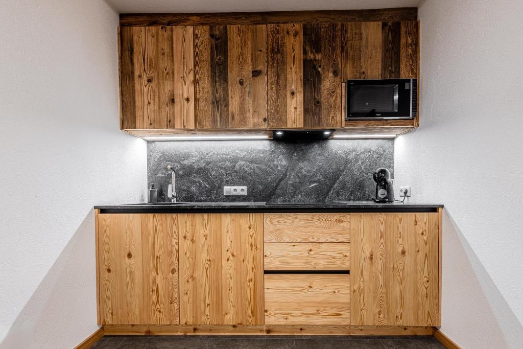 Kuchyň nebo kuchyňský kout v ubytování Appartamenti Residence Ada