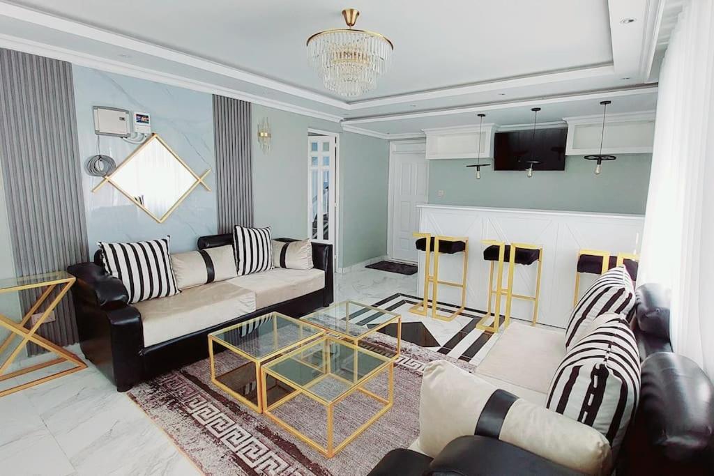 TV a/nebo společenská místnost v ubytování JK Residence Kikuyu