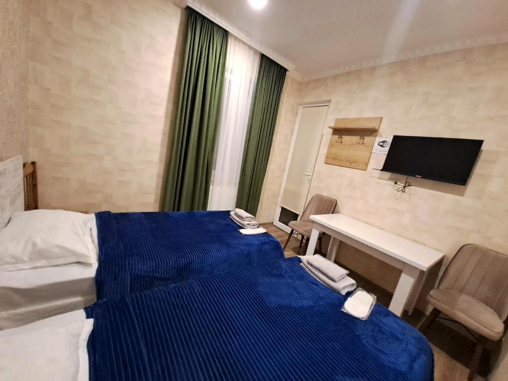 Llit o llits en una habitació de Guest House "AKHALTSIKHE"