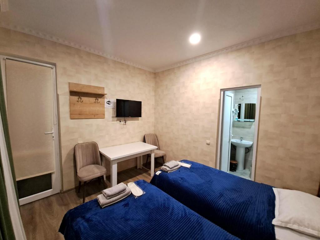 Llit o llits en una habitació de Guest House "AKHALTSIKHE"