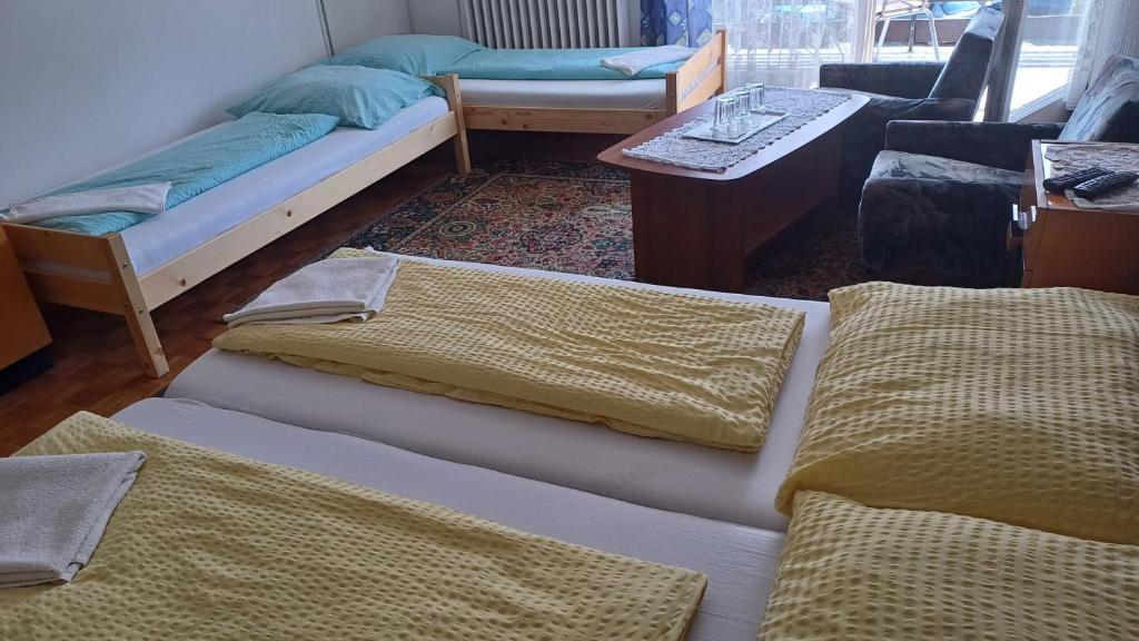 Postel nebo postele na pokoji v ubytování OPEN Vendégház
