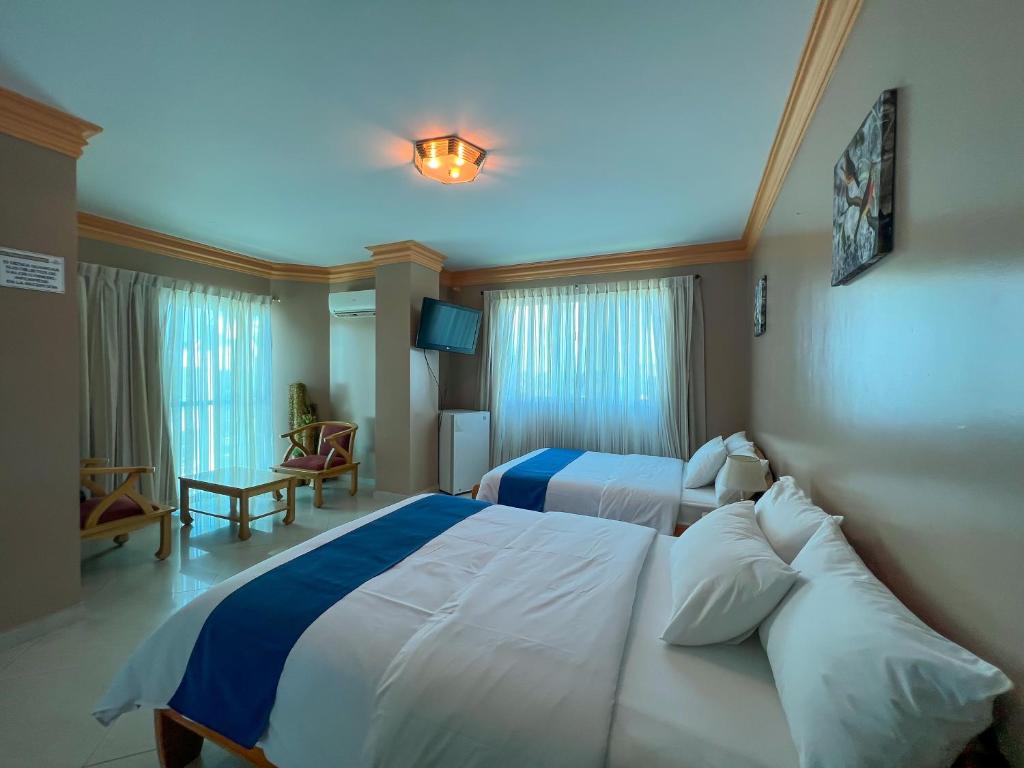 Postel nebo postele na pokoji v ubytování Apart Hotel Hamilton