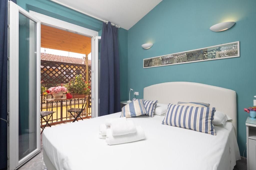 Posteľ alebo postele v izbe v ubytovaní Hotel Jolì
