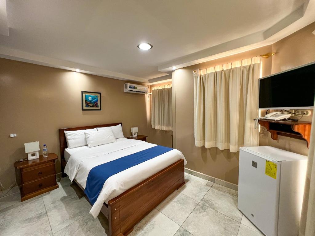 Postel nebo postele na pokoji v ubytování Apart Hotel Hamilton