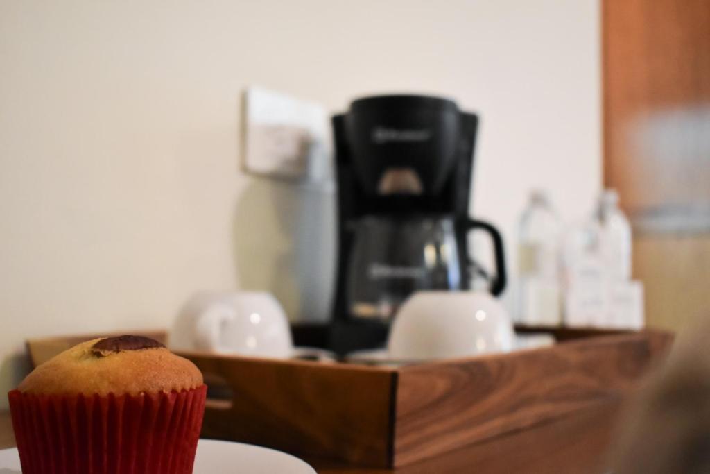 Příslušenství pro přípravu čaje a kávy v ubytování Hotel Isabel