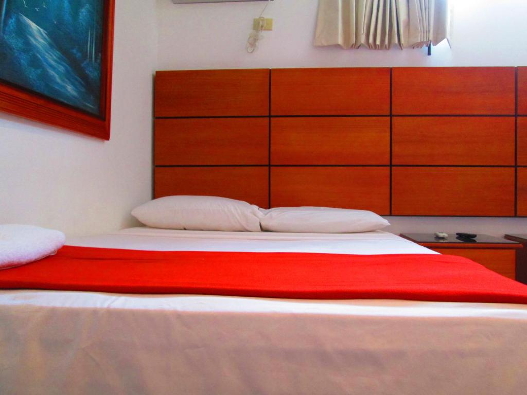 Postel nebo postele na pokoji v ubytování Hotel Apart Guayaquil Aeropuerto