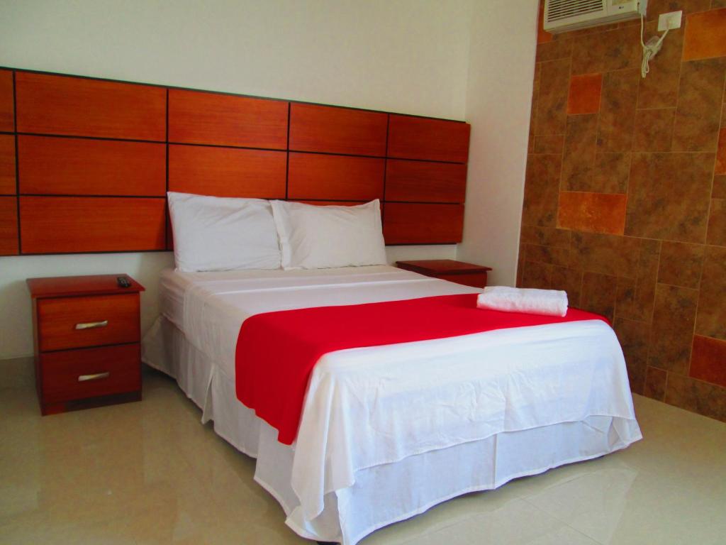 Postel nebo postele na pokoji v ubytování Hotel Apart Guayaquil Aeropuerto