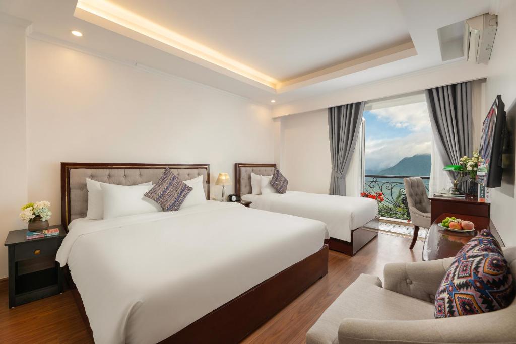 Postel nebo postele na pokoji v ubytování Sapa Praha Hotel