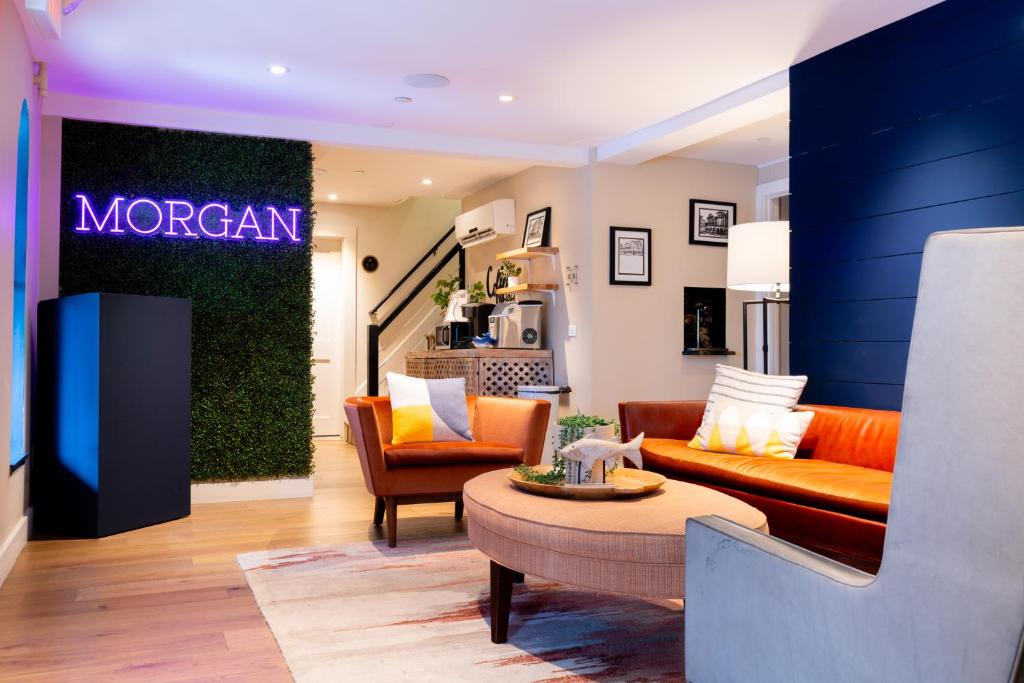 a living room with a couch and a table at The Morgan Hotel Martha's Vineyard in Oak Bluffs