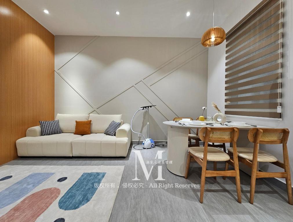 a living room with a couch and a table at Setia Alam Walking Distance Convention Centre Executive Suite 2Pax in Setia Alam