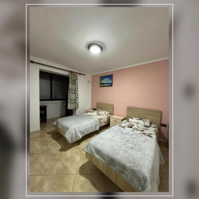 Postel nebo postele na pokoji v ubytování NEO Apartments