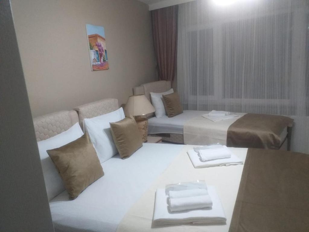 Postel nebo postele na pokoji v ubytování Gürses Home