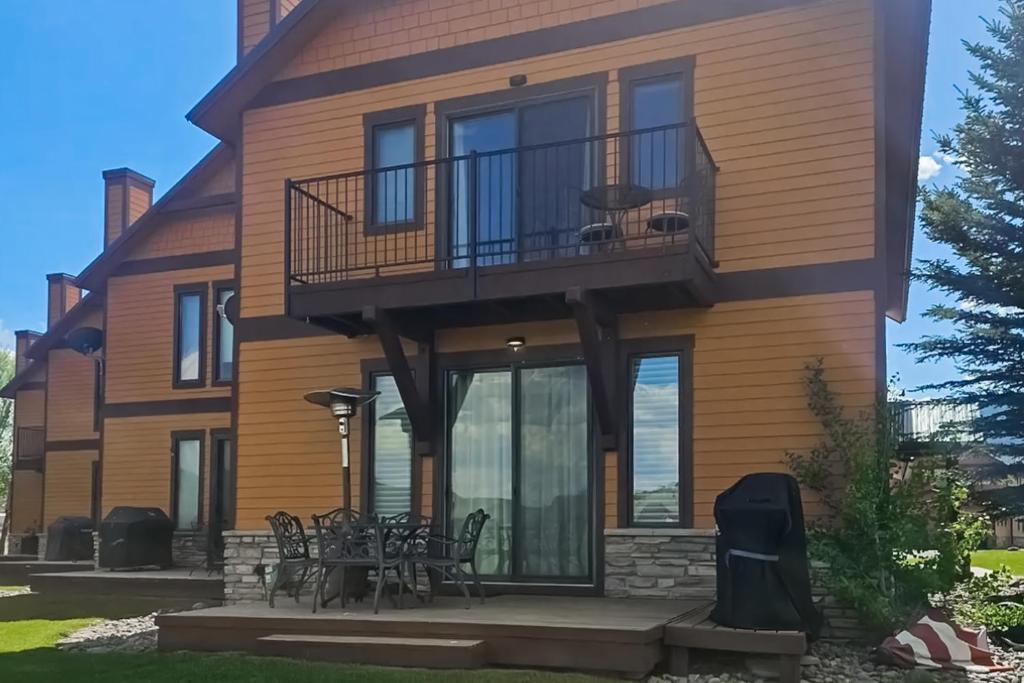 a large wooden house with a balcony at Mountain Retreat in South Fork