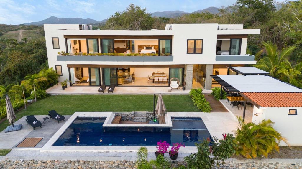 an aerial view of a house with a swimming pool at Near Punta Mita - Gorgeous Modern Villa in Higuera Blanca
