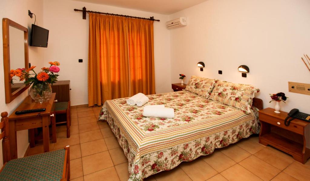 Postel nebo postele na pokoji v ubytování Hotel Sylvia