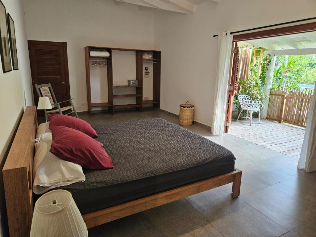 Postel nebo postele na pokoji v ubytování Casa Shambala B&B