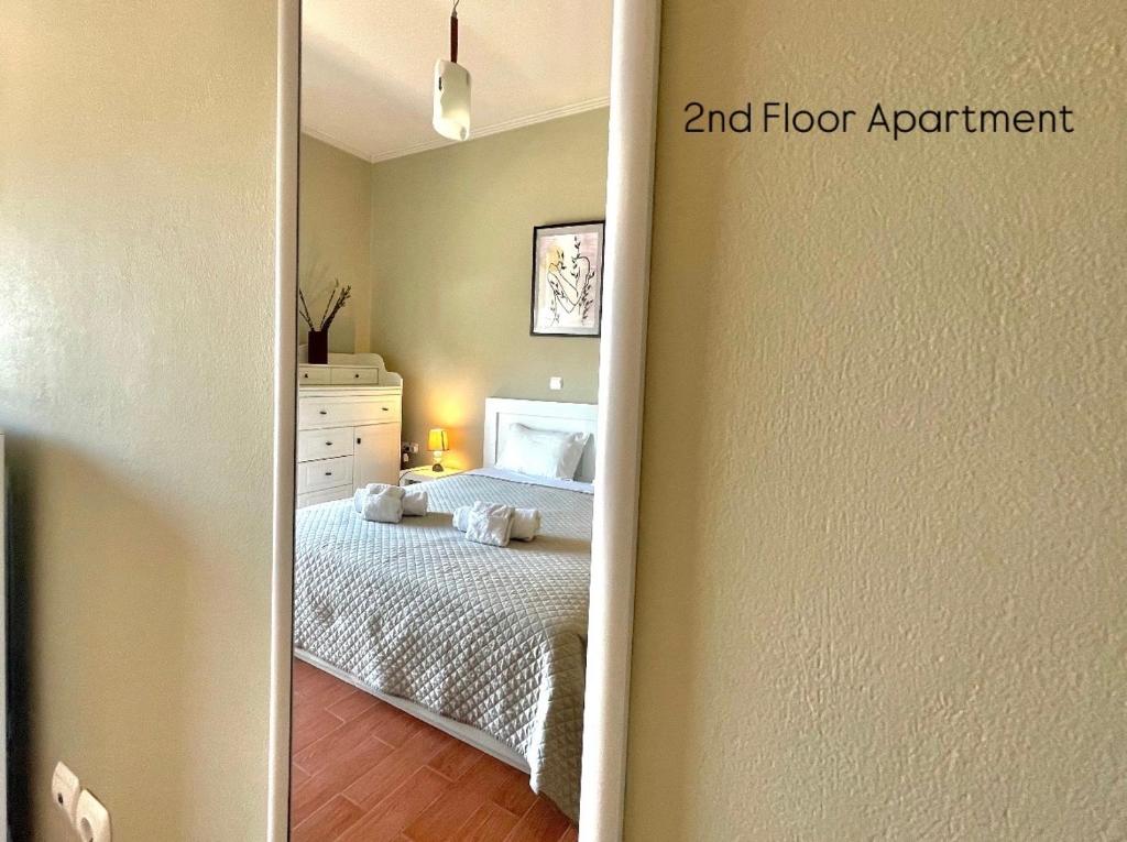 Postel nebo postele na pokoji v ubytování Aggelou Apartments