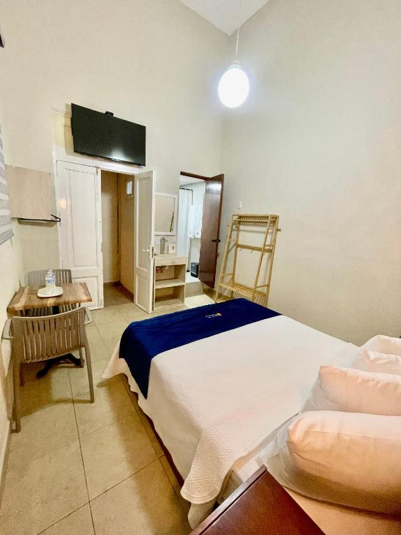 Postel nebo postele na pokoji v ubytování Hotel Real de Castilla Nuovo