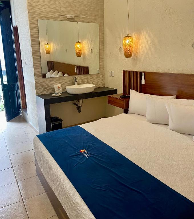Postel nebo postele na pokoji v ubytování Hotel Real de Castilla Nuovo