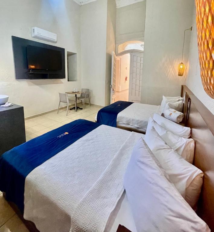 Postel nebo postele na pokoji v ubytování Hotel Real de Castilla Nuovo