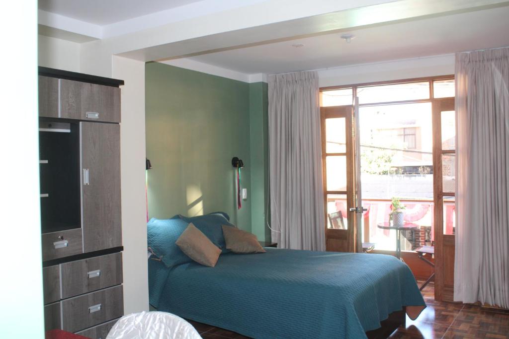 Postel nebo postele na pokoji v ubytování Hotel Incas Suite, con Aguas Termomedicinales